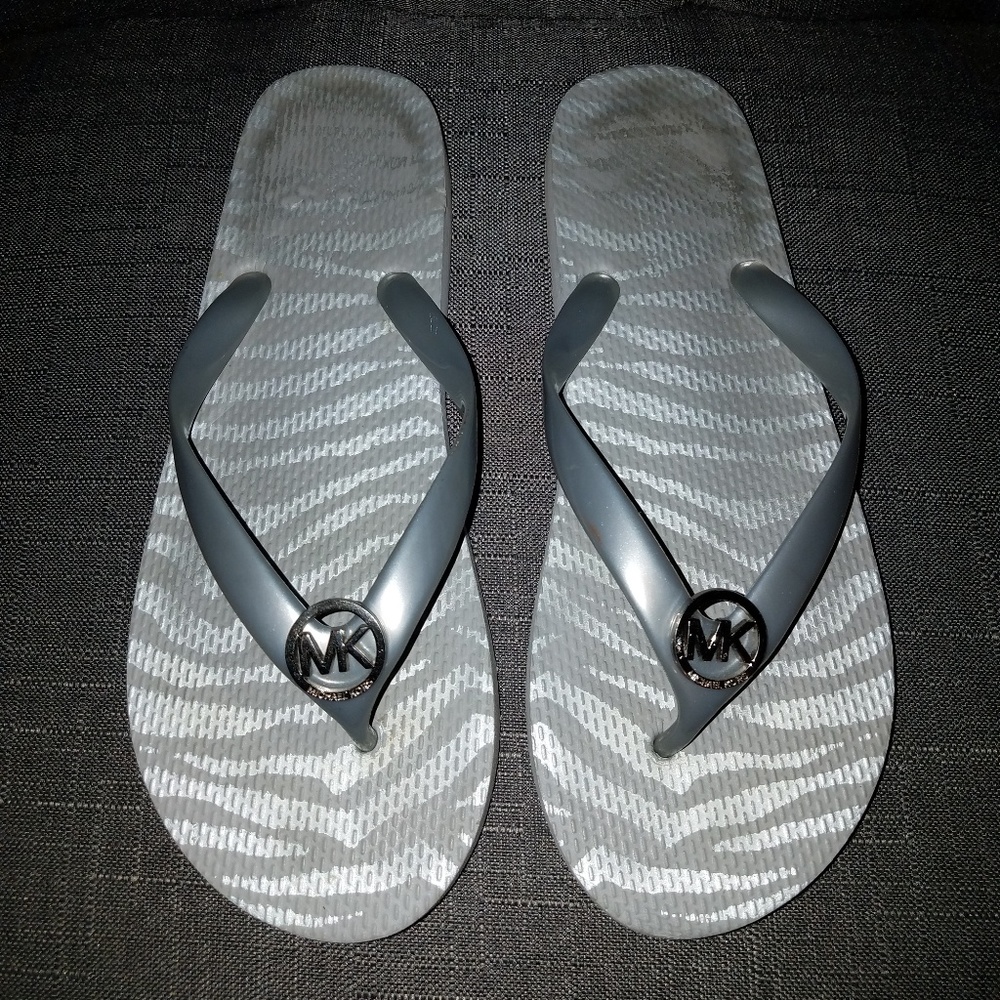 Michael Kors silver flip flops